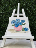 Abstract blue flowers in a pink bowl