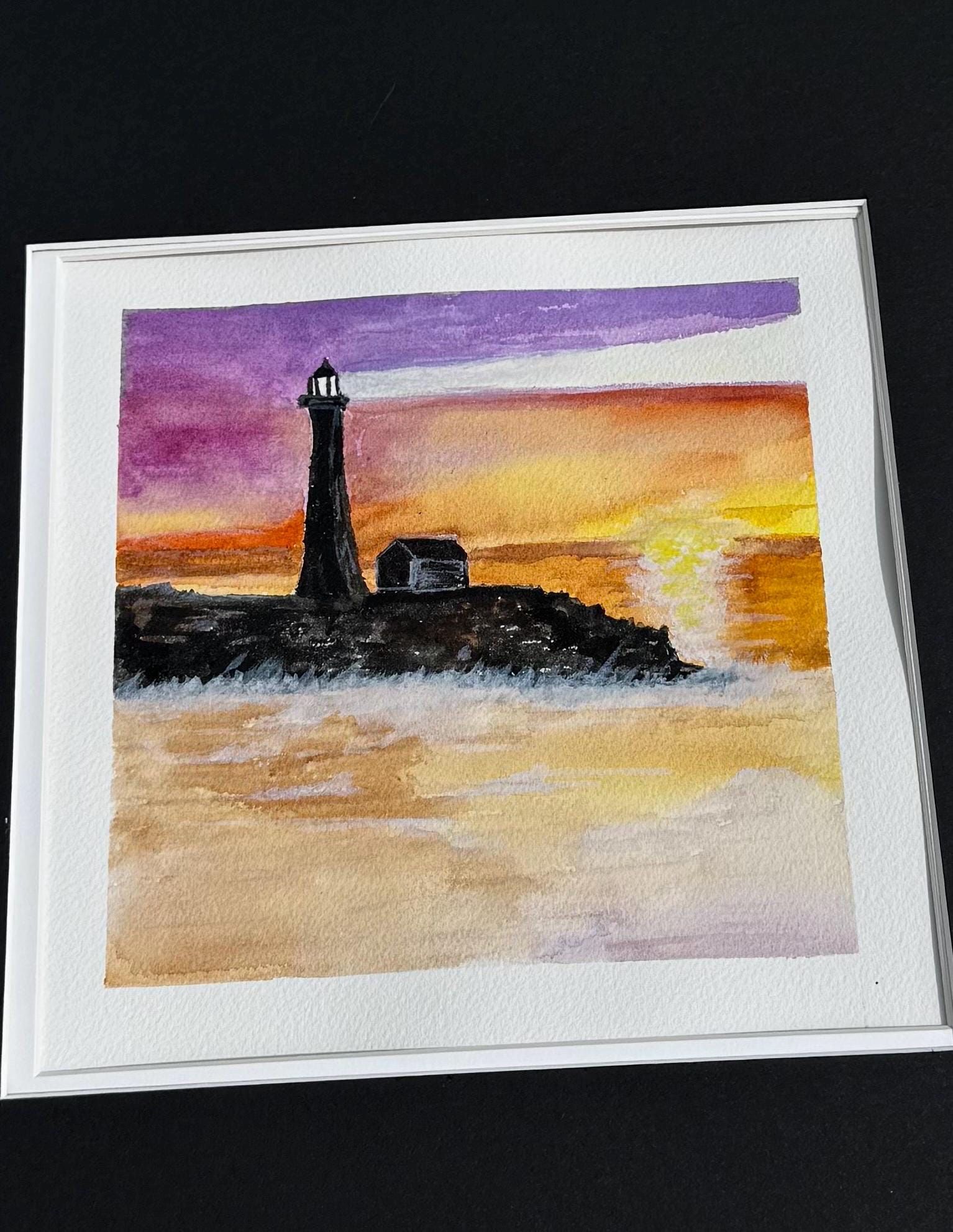 Watercolor lighthouse at night
